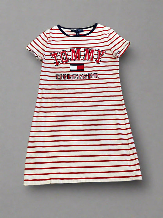 Red and white striped shirt with 'Tommy Hilfiger' logo on a concrete floor
